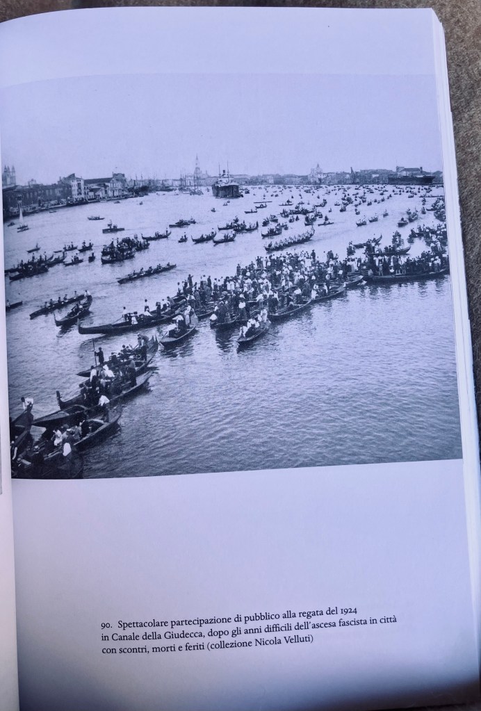 Black and white photo. Traditional boats crowd the Canale della Giudecca as Venetians gather to watch a regatta (1924)